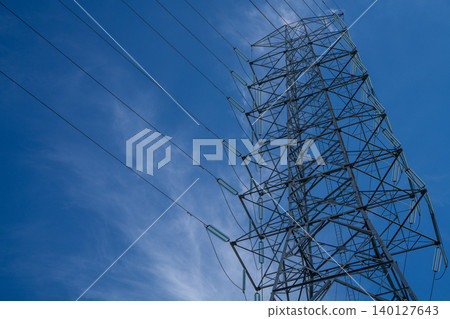 High voltage tower providing electric power transmission, emphasizing industrial infrastructure, supply networks, energy technology, and the critical role of power in addressing the energy crisis. High voltage tower providing electric power transmission, emphasizing industrial infrastructure, supply networks, energy technology, and the critical role of power in addressing the energy crisis. 140127643