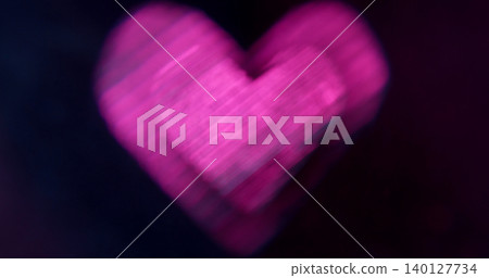 Valentine color. Blur neon heart. Defocused purple shine lens flare glare flicker shape gradient gleam on abstract art dark black background. Valentine color. Blur neon heart. Defocused purple shine lens flare glare flicker shape gradient gleam on abstract art dark black background. 140127734