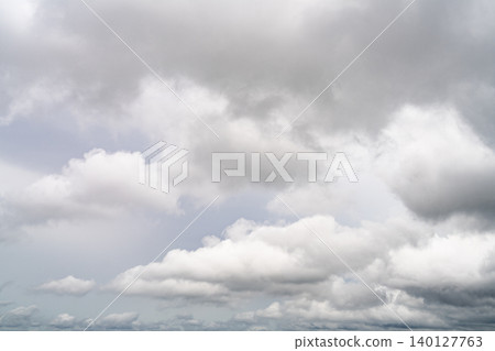 Dramatic overcast sky with gray and white clouds before rainy season storm, moody and gloomy weather background. Climate, meteorology, and atmospheric. Weather forecasting, climate change background. Dramatic overcast sky with gray and white clouds before rainy season storm, moody and gloomy weather background. Climate, meteorology, and atmospheric. Weather forecasting, climate change background. 140127763