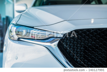Car parked in luxury showroom. Car dealership office. Car showroom business. New car parked in modern showroom. Auto for sale and rent business. Automobile leasing and insurance. Electric automobile. Car parked in luxury showroom. Car dealership office. Car showroom business. New car parked in modern showroom. Auto for sale and rent business. Automobile leasing and insurance. Electric automobile. 140127991