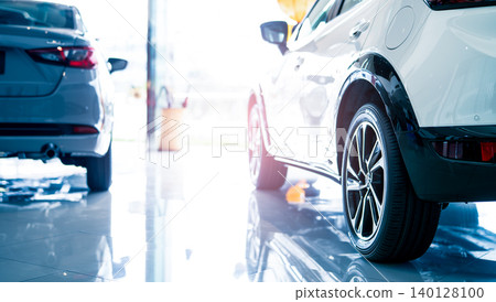 Car parked in luxury showroom. Car dealership office. Car showroom business. New car parked in modern showroom. Auto for sale and rent business. Automobile leasing and insurance. Electric automobile. Car parked in luxury showroom. Car dealership office. Car showroom business. New car parked in modern showroom. Auto for sale and rent business. Automobile leasing and insurance. Electric automobile. 140128100
