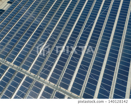 Solar energy for factory and warehouse building. Solar panels on roof of industrial plant. Commercial solar power. Rooftop solar power. Rooftop renewable energy system. Sustainable green energy. Solar energy for factory and warehouse building. Solar panels on roof of industrial plant. Commercial solar power. Rooftop solar power. Rooftop renewable energy system. Sustainable green energy. 140128142