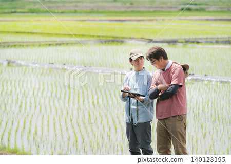 Men using tablets for farming Men using tablets for farming 140128395