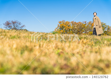 Woman walking up the hill lifestyle image Woman walking up the hill lifestyle image 140128762
