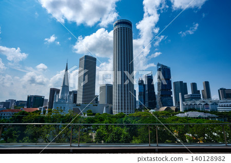 Singapore skyline with St. Andrew's Cathedral. It is an Anglican cathedral in Singapore, the country's largest cathedral. High quality photo Singapore skyline with St. Andrew's Cathedral. It is an Anglican cathedral in Singapore, the country's largest cathedral. High quality photo 140128982