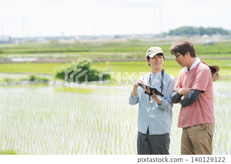 Men using tablets for farming 140129122