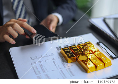 Businessman invest in gold, planning strategy for wealth management and secure gold commodity trading. Businessman invest in gold, planning strategy for wealth management and secure gold commodity trading. 140129578