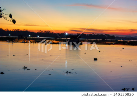 Beautiful Golden Sunset Over a Serene Lake with Water Reflections Beautiful Golden Sunset Over a Serene Lake with Water Reflections 140130920