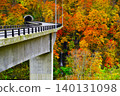 A bridge covered in autumn leaves 140131098