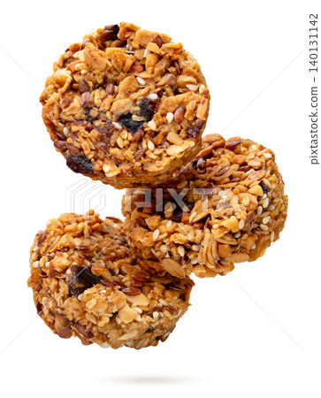Granola cookies flying on a white background. Isolated Granola cookies flying on a white background. Isolated 140131142