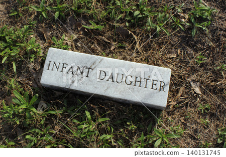Marble Brick in Cemetery With Words Infant Daughter Engraved Marble Brick in Cemetery With Words Infant Daughter Engraved 140131745