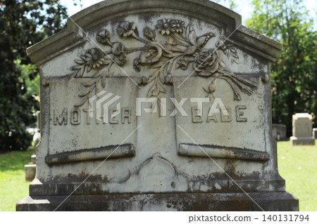 Old Headstone in Historic Cemetery With Word Mother And Babe Engraved Old Headstone in Historic Cemetery With Word Mother And Babe Engraved 140131794