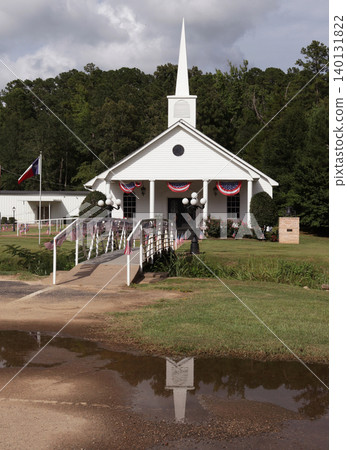 Small White church With Flags in Rural Texas Small White church With Flags in Rural Texas 140131822