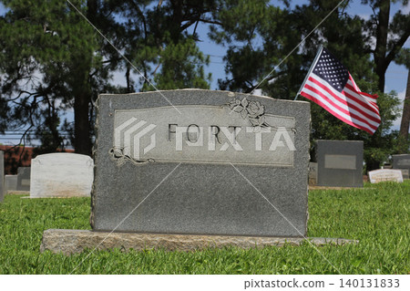 Fort on Granite Headstone With Flag Death of Fort Concept Fort on Granite Headstone With Flag Death of Fort Concept 140131833
