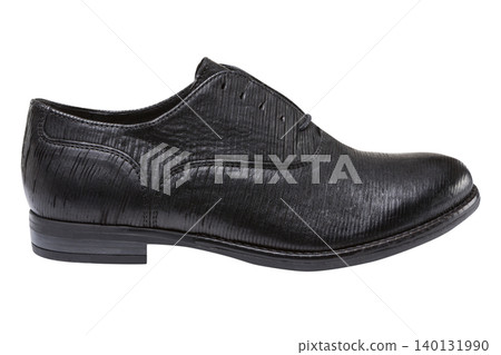 Men black textured leather oxford shoe isolated on white background. Elegant classic dress shoe with ribbed pattern, side view. Men black textured leather oxford shoe isolated on white background. Elegant classic dress shoe with ribbed pattern, side view. 140131990