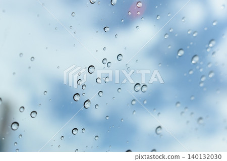 water drop on mirror with blue sky and white cloud background water drop on mirror with blue sky and white cloud background 140132030