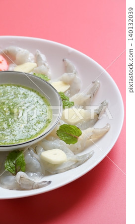 shrimp in fish sauce with Thai spicy seafood dipping sauce on white plate shrimp in fish sauce with Thai spicy seafood dipping sauce on white plate 140132039