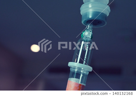 saline solution drip for patient and infusion pump in hospital, close up equipment of medicine 140132168