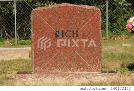 Granite Headstone With Word Rich Engraved. Death Concept Granite Headstone With Word Rich Engraved. Death Concept 140132332
