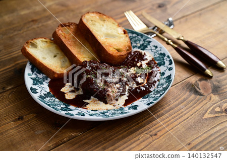 Venison stewed in red wine Venison stewed in red wine 140132547