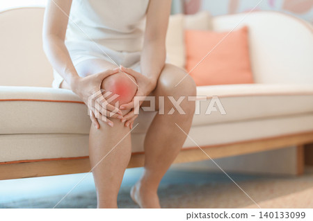 woman having knee ache and muscle pain due to Runners Knee or Patellofemoral Pain Syndrome, osteoarthritis, arthritis, rheumatism and Patellar Tendinitis. health and medical concept 140133099