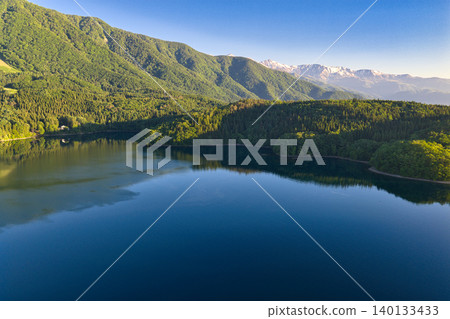 A beautiful early morning view of Lake Aoki in Omachi City, Nagano Prefecture (aerial photograph taken by drone) 140133433