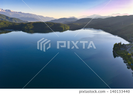 A beautiful early morning view of Lake Aoki in Omachi City, Nagano Prefecture (aerial photograph taken by drone) 140133440