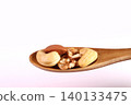 Mixed nuts on a spoon 140133475