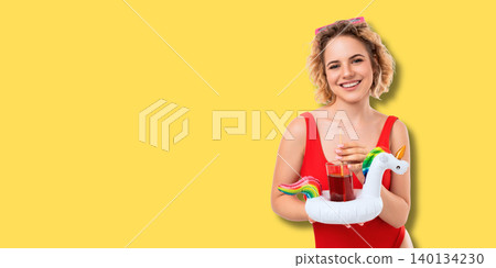 Woman holds drink with inflatable unicorn. Summer concept highlighting joy and vibrant fashion Woman holds drink with inflatable unicorn. Summer concept highlighting joy and vibrant fashion 140134230
