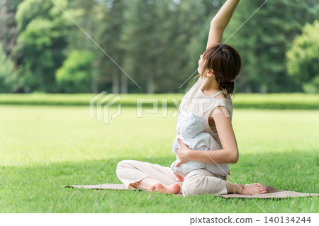 Moms, mothers, and young Asian women doing baby yoga and parent-child yoga. Moms, mothers, and young Asian women doing baby yoga and parent-child yoga. 140134244