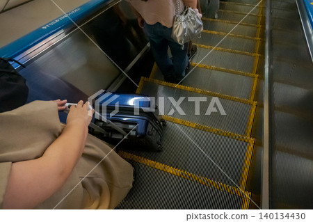 suitcase, escalator, female 140134430