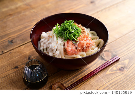 Udon noodles with grated yam, natto (fermented soybeans), and spicy cod roe. Udon noodles with grated yam, natto (fermented soybeans), and spicy cod roe. 140135959