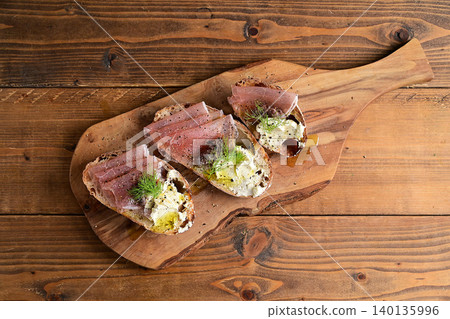 Prosciutto and anchovy cheese open sandwich Prosciutto and anchovy cheese open sandwich 140135996