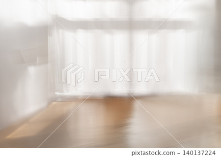 A bokeh background in a living room with light streaming in through the curtains. A bokeh background in a living room with light streaming in through the curtains. 140137224