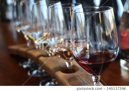 A row of wine glasses A row of wine glasses 140137396