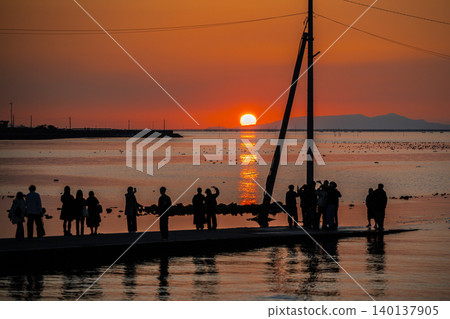 Each person's thoughts as they gaze at the sunset over the sea Each person's thoughts as they gaze at the sunset over the sea 140137905