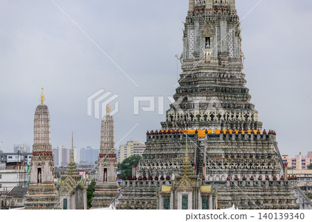 Pagoda at Wat Arun or Temple of dawn a tourist landmark near Chao Phra Ya river in Bangkok Thailand. Wat Arun is a tourist destination and famous landmarks in Thailand. Pagoda at Wat Arun or Temple of dawn a tourist landmark near Chao Phra Ya river in Bangkok Thailand. Wat Arun is a tourist destination and famous landmarks in Thailand. 140139340