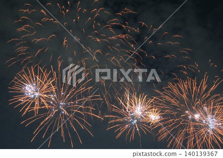 For the first time in three years, the Adachi fireworks display concluded with a beautiful parabolic arc of orange light. For the first time in three years, the Adachi fireworks display concluded with a beautiful parabolic arc of orange light. 140139367