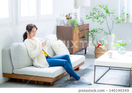 Young woman looking at a smartphone Young woman looking at a smartphone 140140349