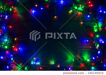 Christmas background with lights and free text space. Christmas lights. Glowing colorful Christmas lights . New Year. Garland. Christmas background with lights and free text space. Christmas lights. Glowing colorful Christmas lights . New Year. Garland. 140140910