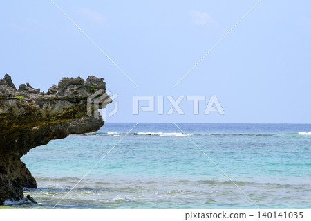 The crystal-clear ocean scenery stretching across the rocky reefs and shallow waters of Okinawa The crystal-clear ocean scenery stretching across the rocky reefs and shallow waters of Okinawa 140141035