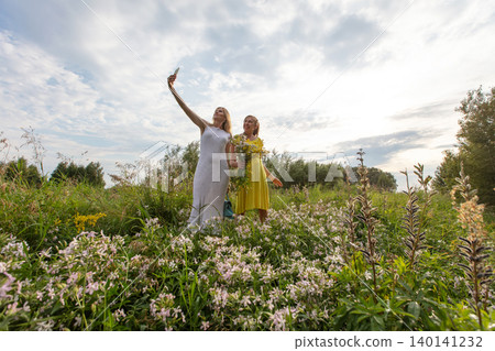 Women enjoy a sunny day in color Women enjoy a sunny day in color 140141232