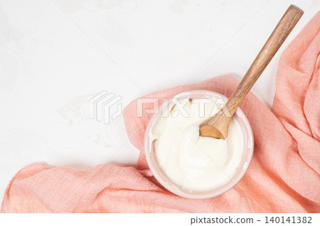 Cake cream. Whipped cream in a bowl. Cream texture. Buttercream texture on top. Making buttercream. 140141382