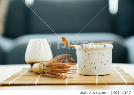 Traditional Matcha green tea set with bamboo whisk and bowl 140141547