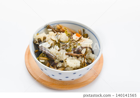 Rice cooked with bracken and wild vegetables Rice cooked with bracken and wild vegetables 140141565