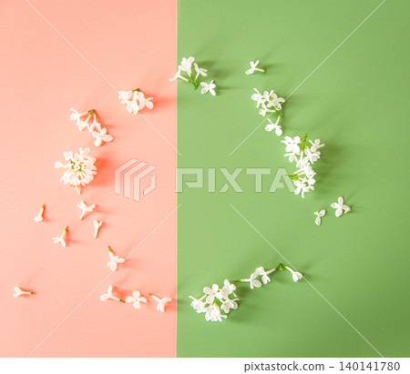 Pastel spring background with scattered lilac blossoms 140141780