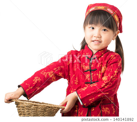 Smiling Asian little girl wearing traditional Chinese costume holding bamboo basket isolated on white background, cultural heritage and festival concept Smiling Asian little girl wearing traditional Chinese costume holding bamboo basket isolated on white background, cultural heritage and festival concept 140141892