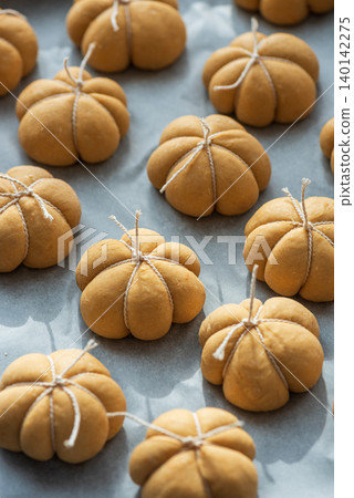 Pumpkin spice bread buns baking for autumn holidays Pumpkin spice bread buns baking for autumn holidays 140142275