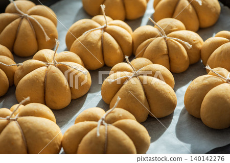 Pumpkin spice bread buns baking for autumn holidays Pumpkin spice bread buns baking for autumn holidays 140142276
