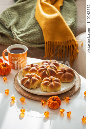Cozy autumn home atmosphere with pumpkin buns and decor Cozy autumn home atmosphere with pumpkin buns and decor 140142281